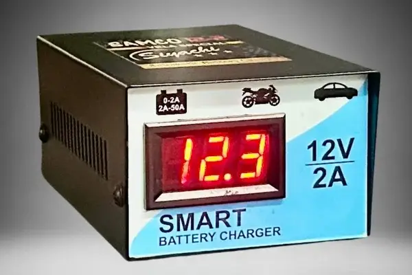 SAMCO motorcycle battery charger side view showing metal construction and compact design