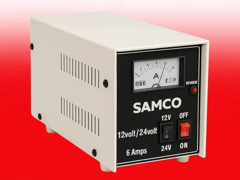 Professional 12V/24V 6A SMPS Battery Charger with manual voltage selector switch, analog display meter, auto cut-off protection for cars, trucks, buses and commercial vehicles